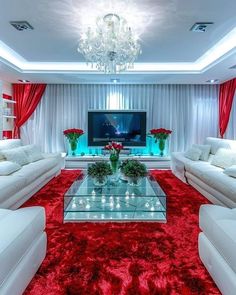 a living room with red carpet and white furniture