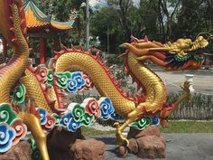 colorful dragon statues in front of a building