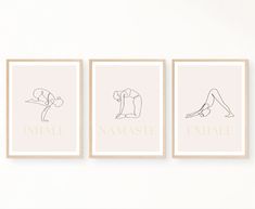 three framed art prints depicting yoga poses