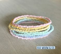 Pastel rainbow stack made with 7 soft pastel macaroon beads. The perfect accessory to make your outfit shine! Visit IG or Etsy to order or explore more styles! Pastel Macaroons, Make Your Outfit, Pastel Rainbow, Soft Pastel, Marketing And Advertising