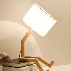 a lamp that is on top of some books