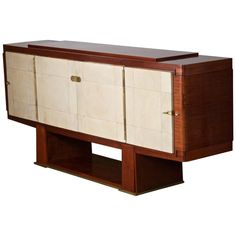 an art deco sideboard with two doors and drawers