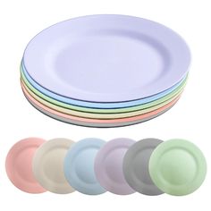 six pastel plates with different colored rims on each plate, all stacked up