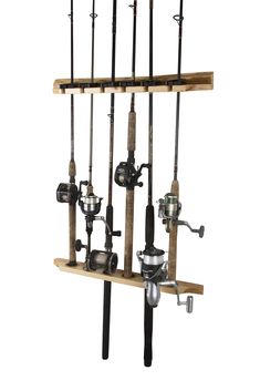 an assortment of fishing rods and reels hanging on a wall