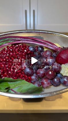 a bowl filled with grapes, radishes and broccoli on top of a counter