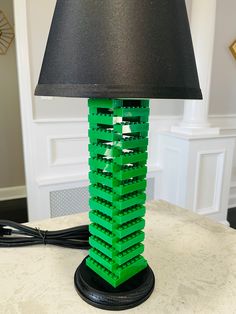 a lamp made out of legos sitting on top of a table