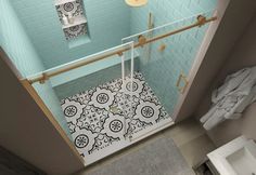 an aerial view of a bathroom with blue walls and floor tiles on the shower stall