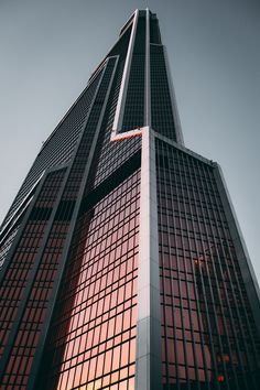 the top of a tall building with lots of windows on it's face and sides