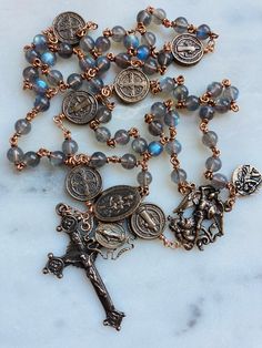 This rosary is handmade with 20 gauge bronze wire and chain, and bronze rosary medals.  The stones are 4, 6 and 9mm labradorite gemstones. Protection Medals: St Benedict  St Michael St Christopher Miraculous Medal  Scapular Medal Spiritual Rosary With Miraculous Medal And Crucifix, Antique Rosary, Adjustable Spiritual Rosary With Miraculous Medal, Bronze Rosary With Round Beads As Gift, Handmade Spiritual Bronze Rosary, Handmade Bronze Spiritual Rosary, Saint Michael