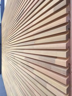 the side of a building with wooden slats on it