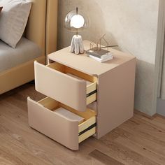 a night stand with two drawers and a lamp