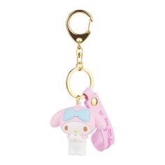 a keychain with a cartoon character on the front and bottom, hanging from a metal hook