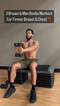 a man sitting on top of a bench with dumbbells in front of him