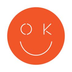 an orange circle with the word ok written in white on top of it and a smiley face