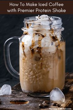 an iced coffee in a mason jar with ice cubes on the side and text overlay that reads how to make iced coffee with premer protein shake