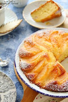 a cake on a plate with powdered sugar