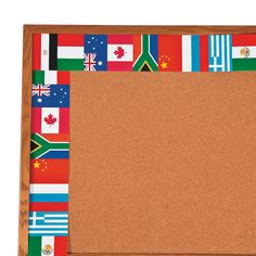 a cork bulletin board with flags on it