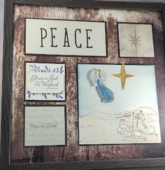 a wooden frame with some pictures on it and a star hanging from the wall next to it