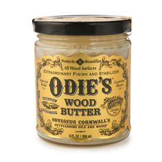 an old fashioned wooden butter is shown on a white background with the words, odie's wood butter