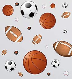 an assortment of sports balls flying through the air