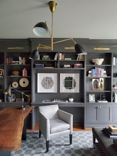 a living room filled with furniture and bookshelves