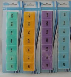 four different colored plastic file folders with writing on each side and words in the middle