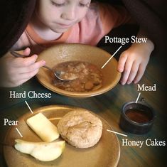 a young child is eating some food on a plate with other foods in front of him