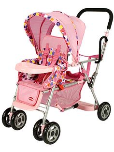 a pink baby stroller with polka dots on it