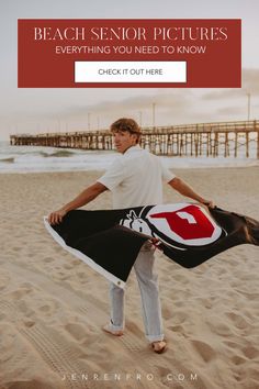 a man standing on top of a sandy beach holding a black and white blanket with the words beach senior pictures everything you need to know