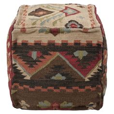 a brown and red ottoman sitting on top of a white floor