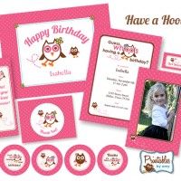 an owl themed birthday party with pink and white items, including personalized photo frames