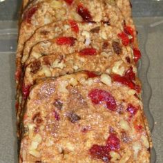 there are four slices of fruit cake in the plastic container on the table, ready to be eaten