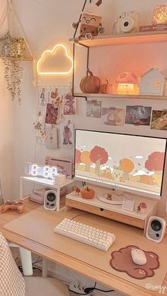 a desk with a computer and speakers on it