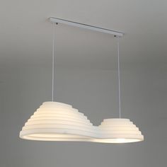 a light fixture hanging from the ceiling in a room