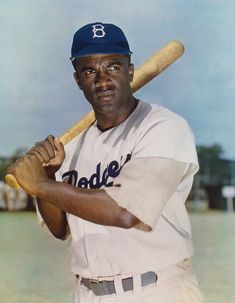 a baseball player holding a bat on top of a card