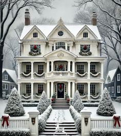 a large white house with christmas decorations on the front