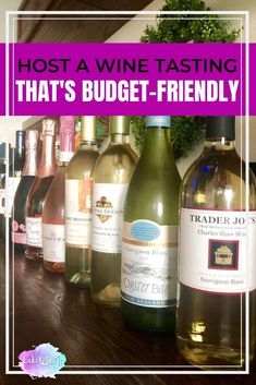 bottles of wine sitting on top of a wooden table next to each other with the words host a wine tasting that's budget - friendly