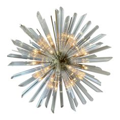 a chandelier with many lights hanging from it's center point, in the shape of a starburst