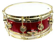 a red and gold drum is shown against a white background