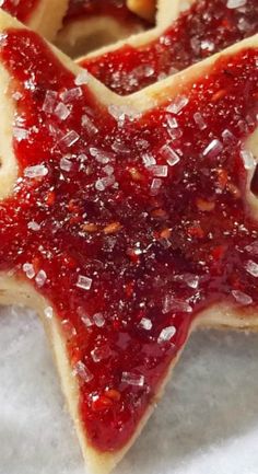 a star shaped cookie with jelly toppings on it