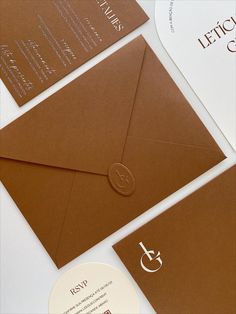 an envelope and business cards on top of each other with the letter s in it