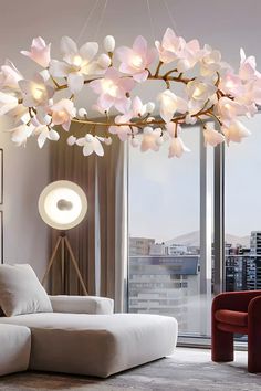 a living room filled with furniture and a flower chandelier hanging from the ceiling