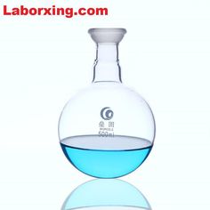 a glass flask filled with blue liquid