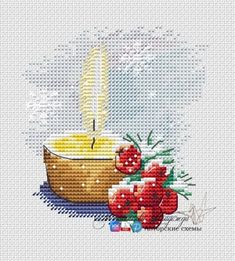 a cross stitch pattern with a lit candle and pomegranates on it