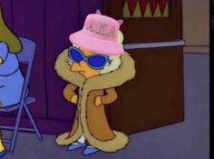 the simpsons character is wearing sunglasses and a pink hat while standing in front of a chair