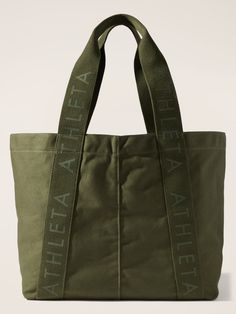 FOR: Commuting, work, and travel FEEL: Natural canvas is lightweight and durable FAVE: Comfort-first strap design for carrying any weight One size. Utility Tote Bag, Logo Tote Bag, Waterproof Tote, Green Tote Bag, Best Designer Bags, Perfect Purse, Utility Tote, Work And Travel, Senior Gifts