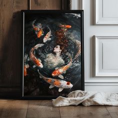 a painting of a woman surrounded by koi fish in a room with wood floors