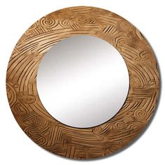 a round wooden mirror sitting on top of a white wall