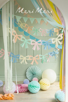 Pastel bow garlands hanging with other tissue paper bunting and honeycomb decorations. Meri Meri Garland, Pastel Party Backdrop, Surprise Birthday Decorations, Baby Deco, Pastel Bows, Paper Balloon, Pearl Party, Baby Birthday Decorations, Garland Backdrops