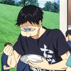 an anime character holding a plate with chopsticks in his hand and looking down